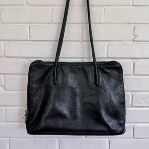 Elegant Black Leather Shoulder Bag by Chloe and Patek